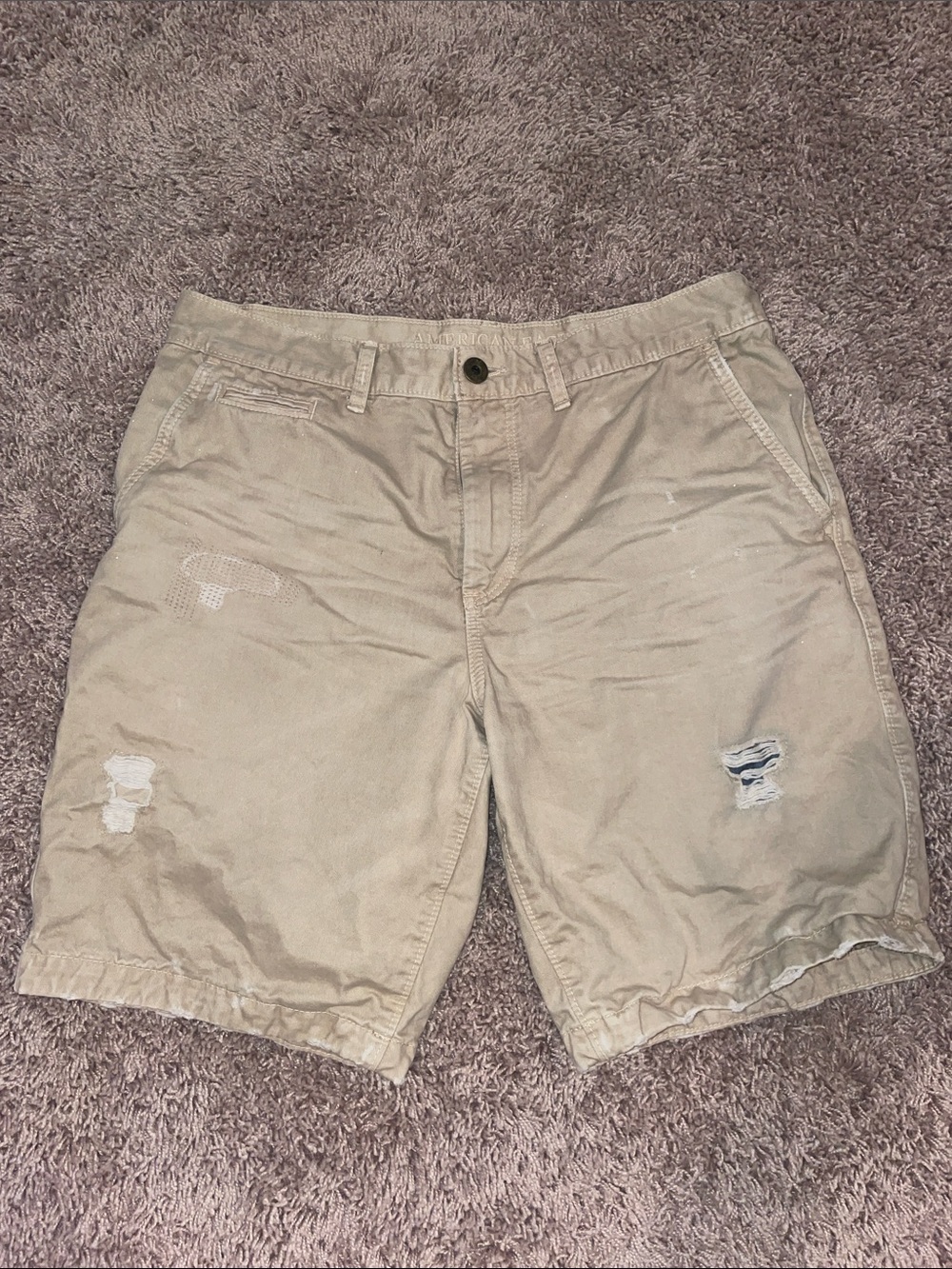 Gently worn distressed American Eagle khaki flat front shorts size 32